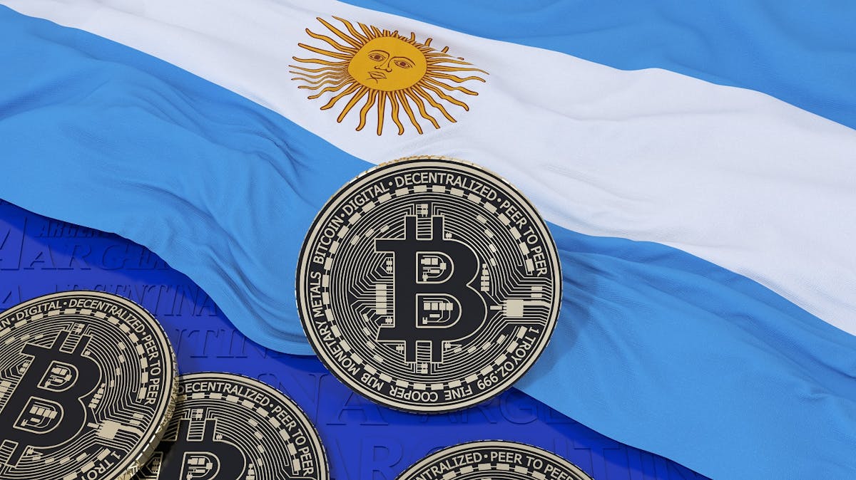 Bitcoin over an Argentinian flag